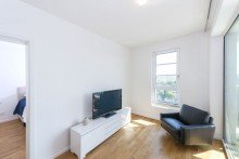Wohnbereich VERMIETET: Pandion Le Grand: Traumhaft möbliert wohnen mit Concierge, Stellplatz, Gym, Sauna und Weitblick